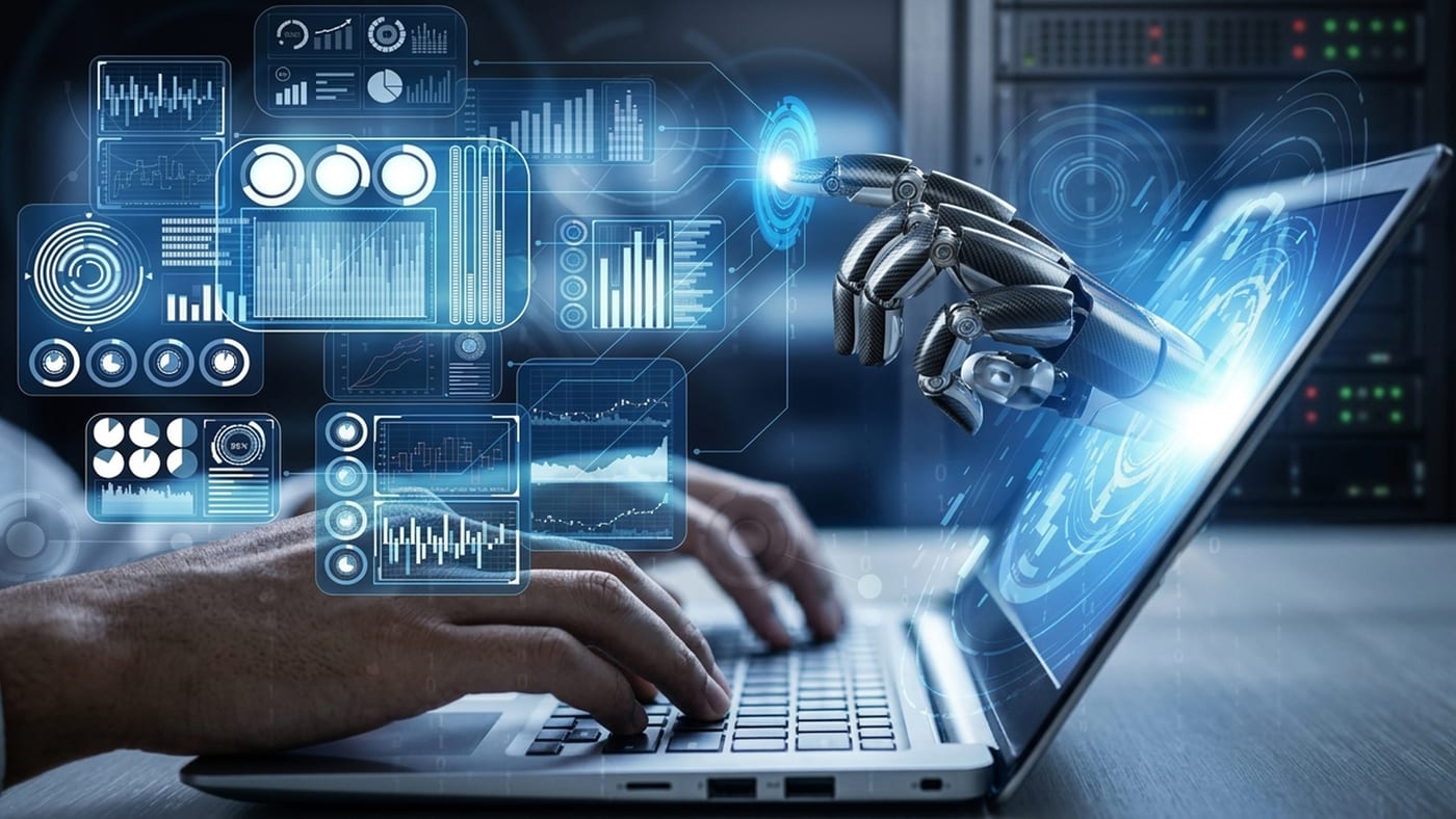 A robotic hand and a person's hands working at the same laptop, surrounded by data dashboards