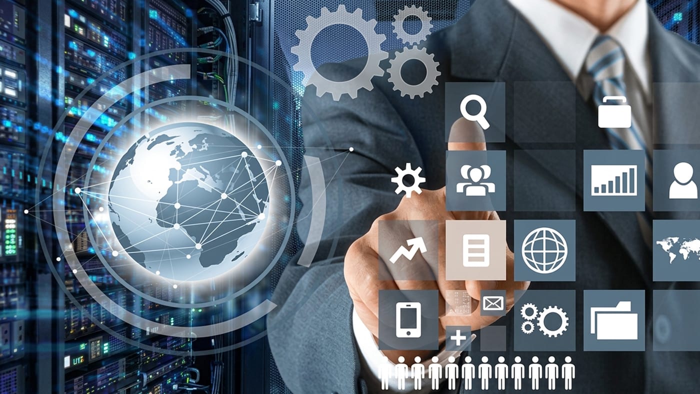 A technology leader selecting services on a touch interface in front of a data centre